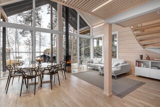 a-view-from-the-kitchen-out-toward-the-living-area-provides-a-sense-of-the-lofted-interior.