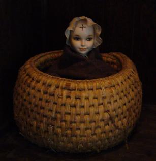 bebe_avec_une_croix_sur_le_front.