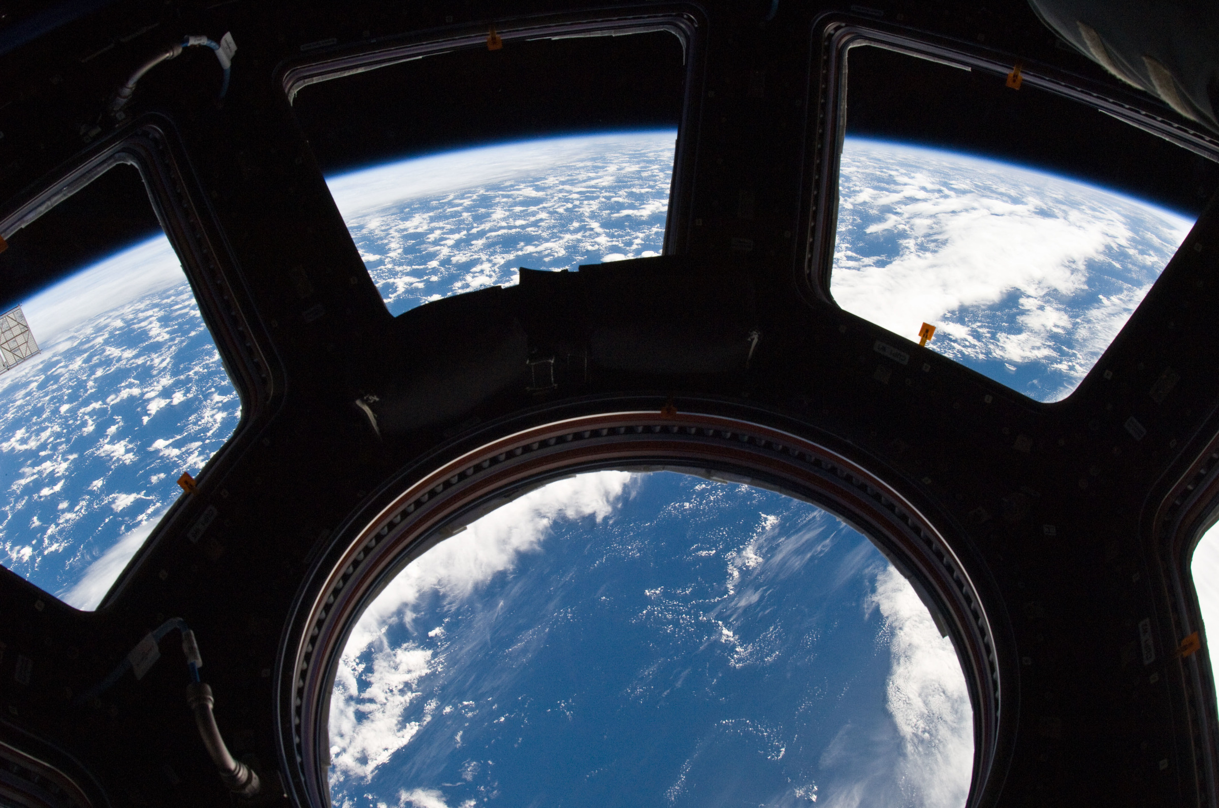 earth_and_its_horizon_seen_through_the_windows_in_cupola.