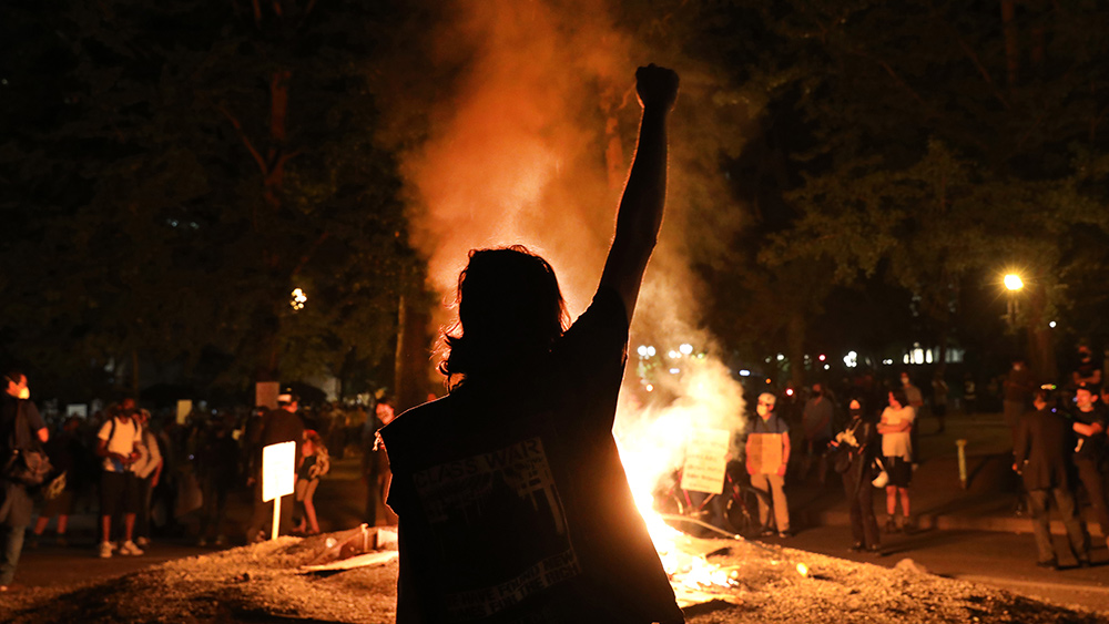 Portland-Riot-Protests-Fire-Fist-Raised.